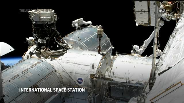 NASA astronauts conduct spacewalk to upgrade ISS